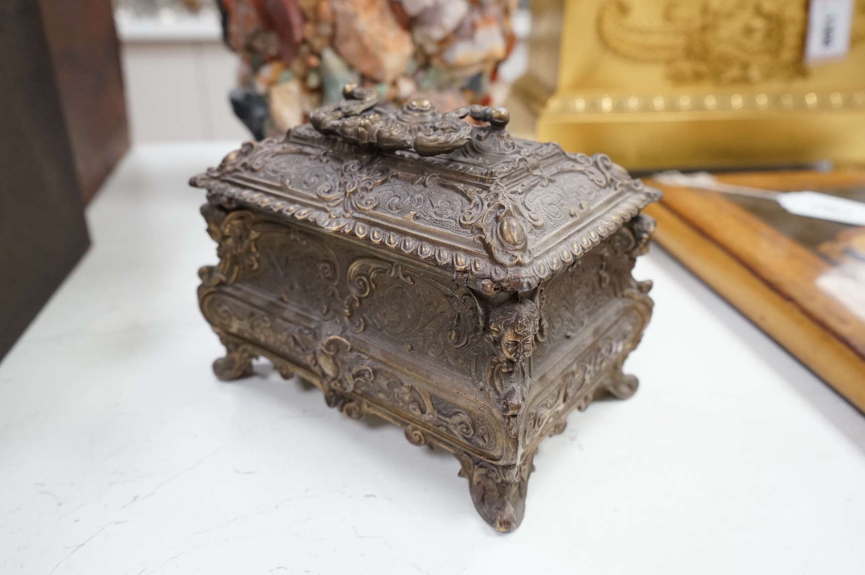 A rococo-style rectangular bronze casket and key, 17cm wide